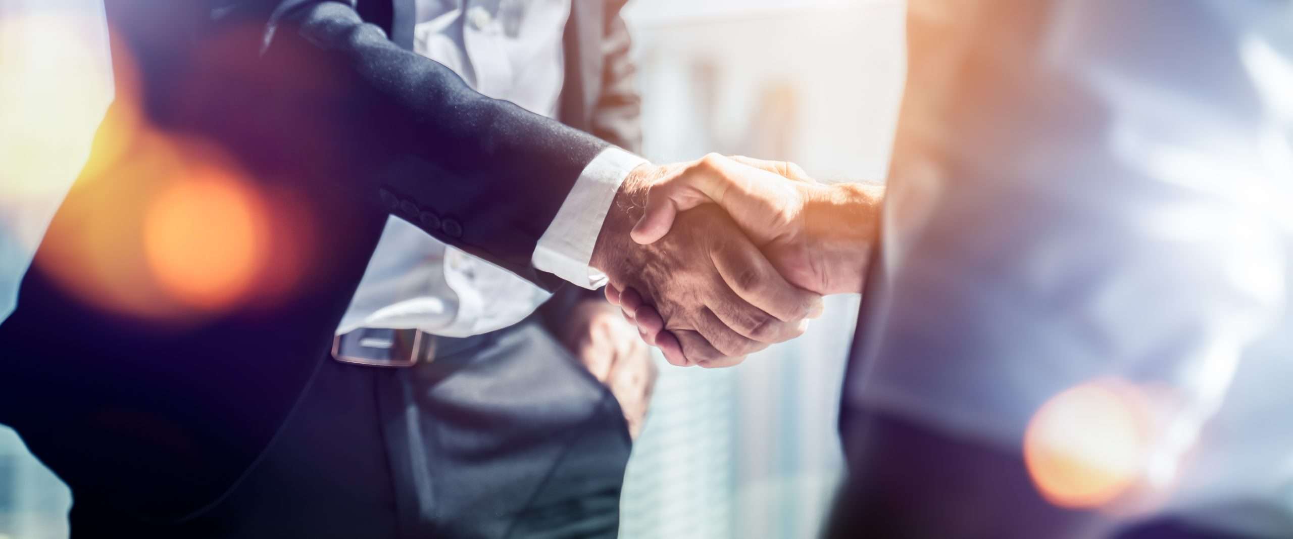 Businessman handshake for teamwork of business merger and acquis